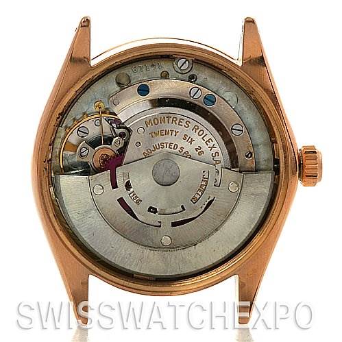 The image shows the back of a Rolex Vintage Collection 1003 Stainless Steel Silver Dial 1003 Stainless Steel Silver Dial watch, highlighting its inner mechanical movement.