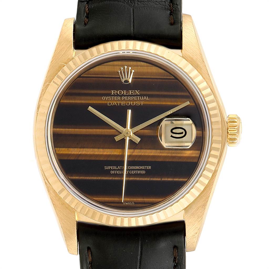 The image shows a front view of the Rolex Vintage Collection 16018 Men's Yellow Gold Brown Dial 16018 Men's Yellow Gold Brown Dial Oyster Perpetual Datejust watch with a leather strap and date display.