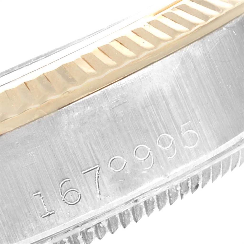 This image shows a close-up of the side of the bezel and case of a Vintage Collection Rolex watch, featuring its model number.