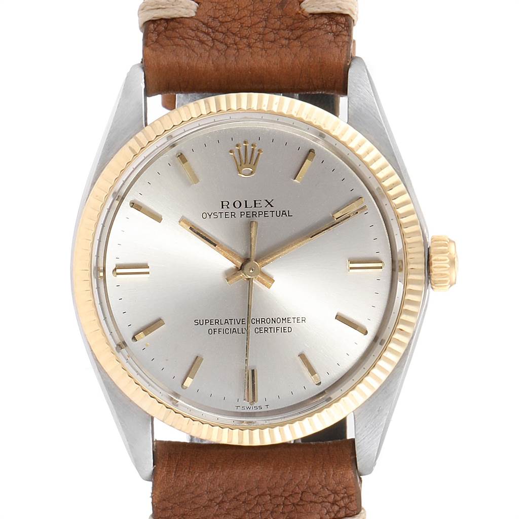 The image shows a front view of the Rolex Vintage Collection 1005 Men
s Steel and Gold (two tone) Silver Dial 1005 Men
s Steel and Gold (two tone) Silver Dial model, displaying the dial, bezel, and part of the leather strap.