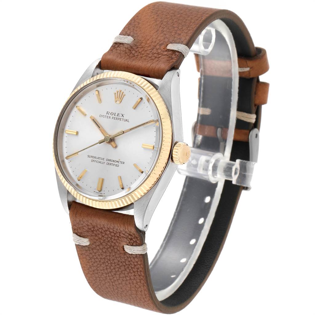 The watch is shown at a slight angle showcasing the face, bezel, crown, and leather strap of the Rolex Vintage Collection 1005 Men
s Steel and Gold (two tone) Silver Dial 1005 Men
s Steel and Gold (two tone) Silver Dial model.