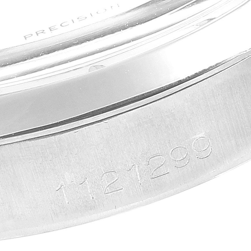 This close-up image shows the engraved serial number on the case of a Rolex Vintage Collection 6694 Men's Stainless Steel Silver Dial 6694 Men's Stainless Steel Silver Dial watch.
