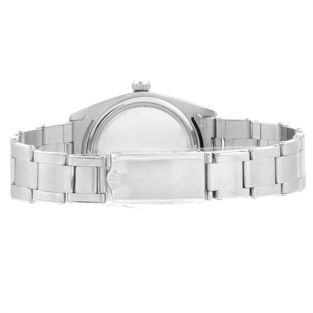 The image shows the back view of a Rolex Vintage Collection 6694 Men's Stainless Steel Silver Dial 6694 Men's Stainless Steel Silver Dial watch, focusing on the case back and bracelet clasp.