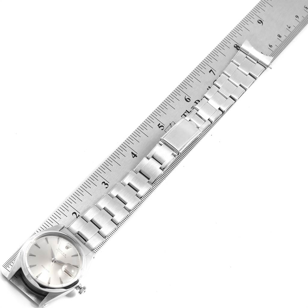The image shows a top-down view of the Vintage Collection Rolex watch with its bracelet aligned next to a ruler.