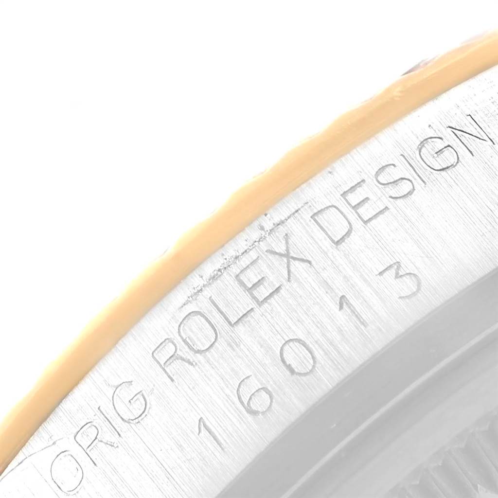 This close-up shot shows the side engraving of the Rolex Vintage Collection 16013 Men's Stainless Steel Silver Dial 16013 Men's Stainless Steel Silver Dial watch model 16013.