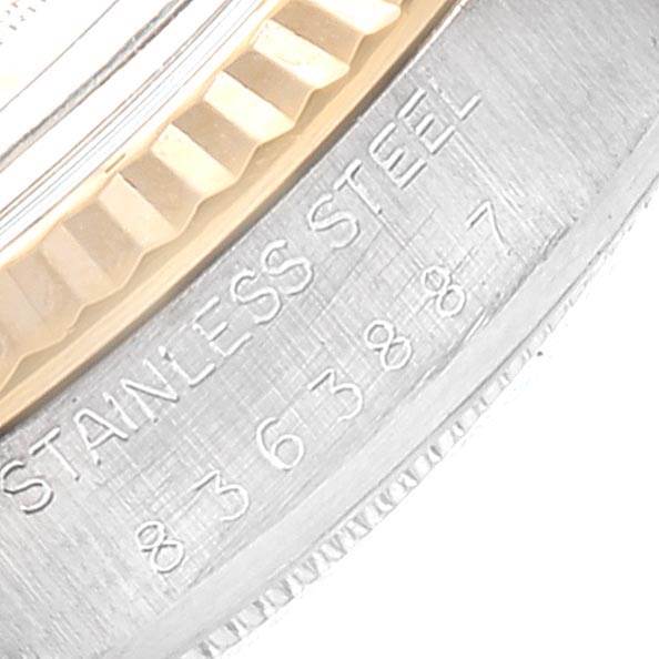 This close-up image shows a partial view of the bezel and case of a Rolex Vintage Collection 16013 Men's Stainless Steel Silver Dial 16013 Men's Stainless Steel Silver Dial model, including "STAINLESS STEEL" engraving.