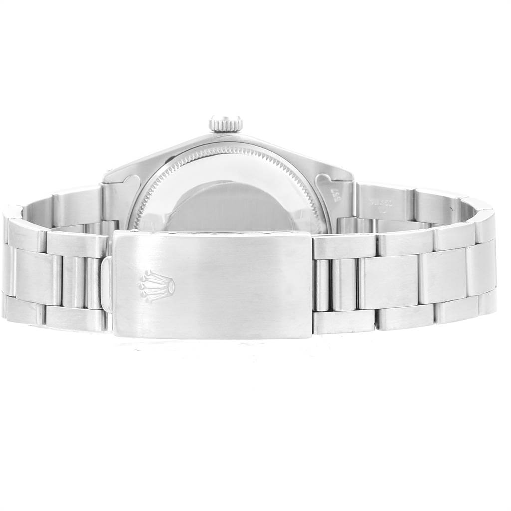 The image shows the back view of a Vintage Collection Rolex watch, highlighting the case back and stainless steel bracelet.