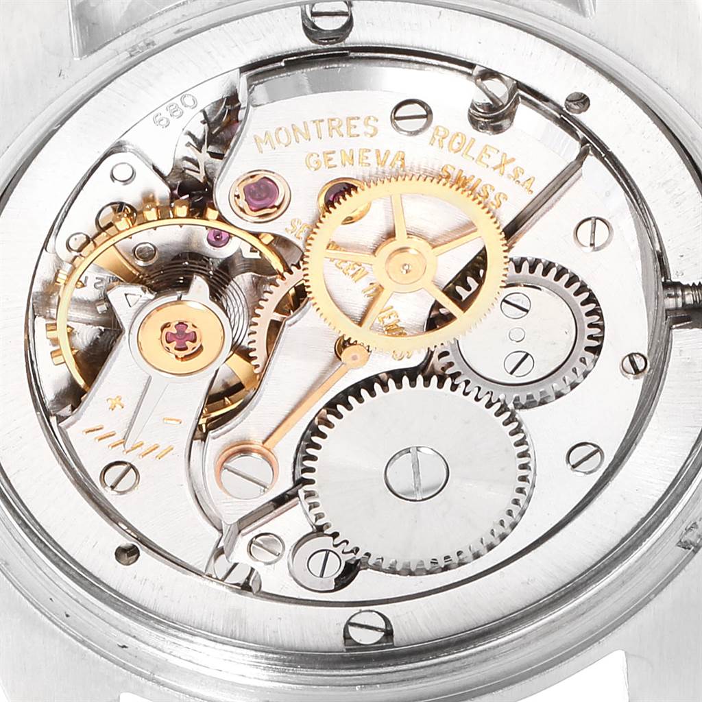 This image shows the intricate inner mechanism of the Rolex Vintage Collection 6694 Men's Stainless Steel Silver Dial 6694 Men's Stainless Steel Silver Dial model watch, focusing on the gears and movement.