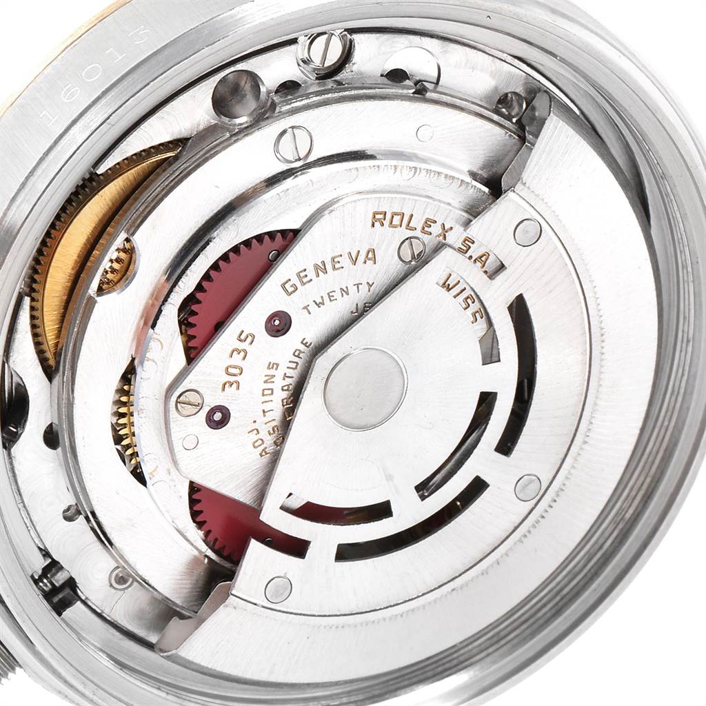 This image shows the internal movement of a Vintage Collection Rolex watch at a close-up angle displaying the gears and mechanisms.