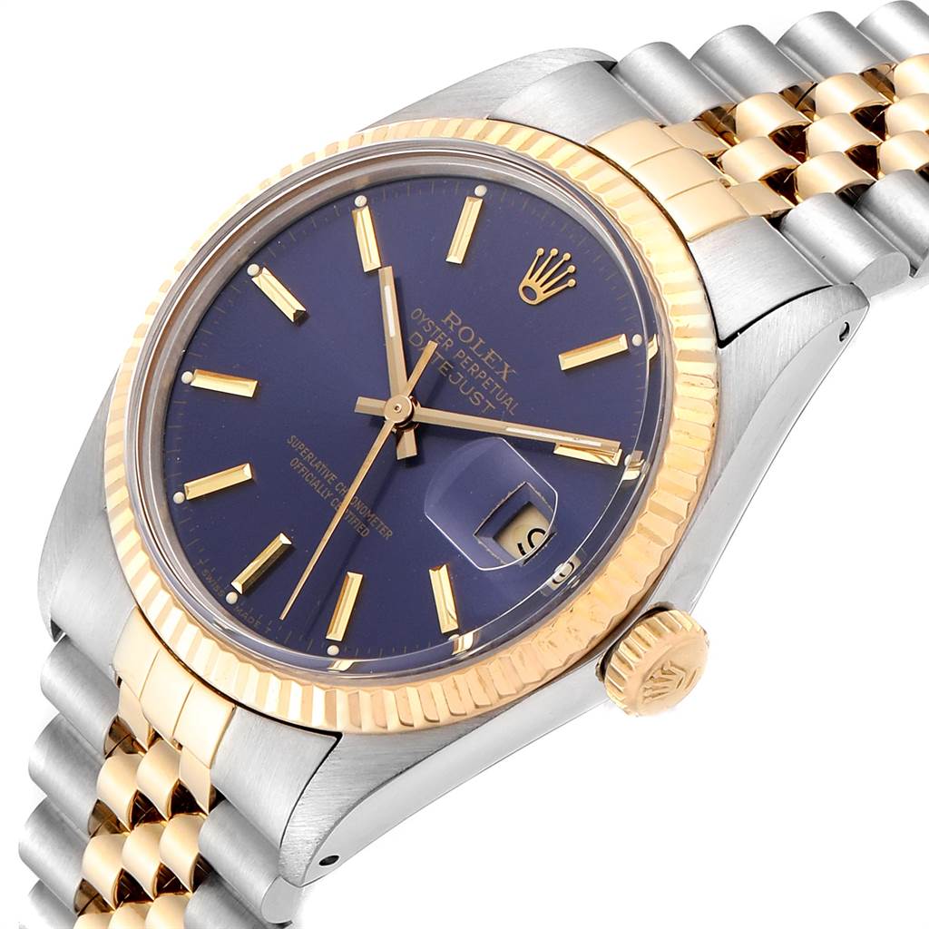 The image shows a close-up angled view of a Rolex Vintage Collection 16013 Men's Stainless Steel Blue Dial 16013 Men's Stainless Steel Blue Dial watch featuring a gold bezel, blue dial, and metal bracelet.