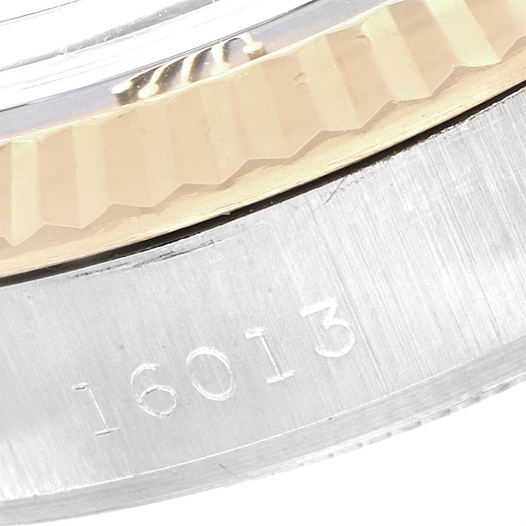 This close-up image shows a portion of the bezel and serial number "16013" engraved on the case of a Rolex Vintage Collection 16013 Men's Stainless Steel Blue Dial 16013 Men's Stainless Steel Blue Dial watch.