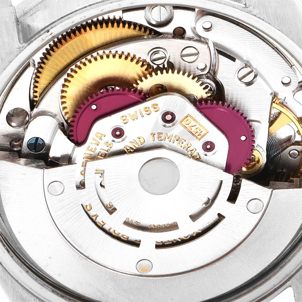 This image shows the intricate internal gears of a Rolex Vintage Collection 1501 Men
s Stainless Steel Black Dial 1501 Men
s Stainless Steel Black Dial watch movement from a close-up angle.