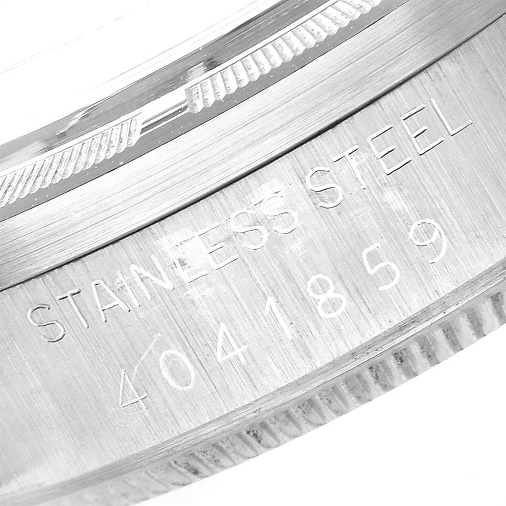 The image shows a close-up of the stainless steel case body and edge of the bezel of the Rolex Vintage Collection 1501 Men
s Stainless Steel Black Dial 1501 Men
s Stainless Steel Black Dial model, including its serial number.