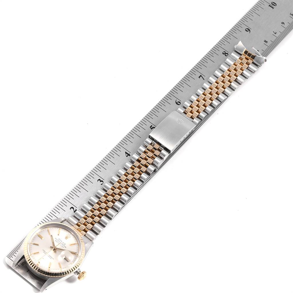 The image shows a top view of a Vintage Collection Rolex watch with a measurement scale, focusing on the dial, bezel, and bracelet.