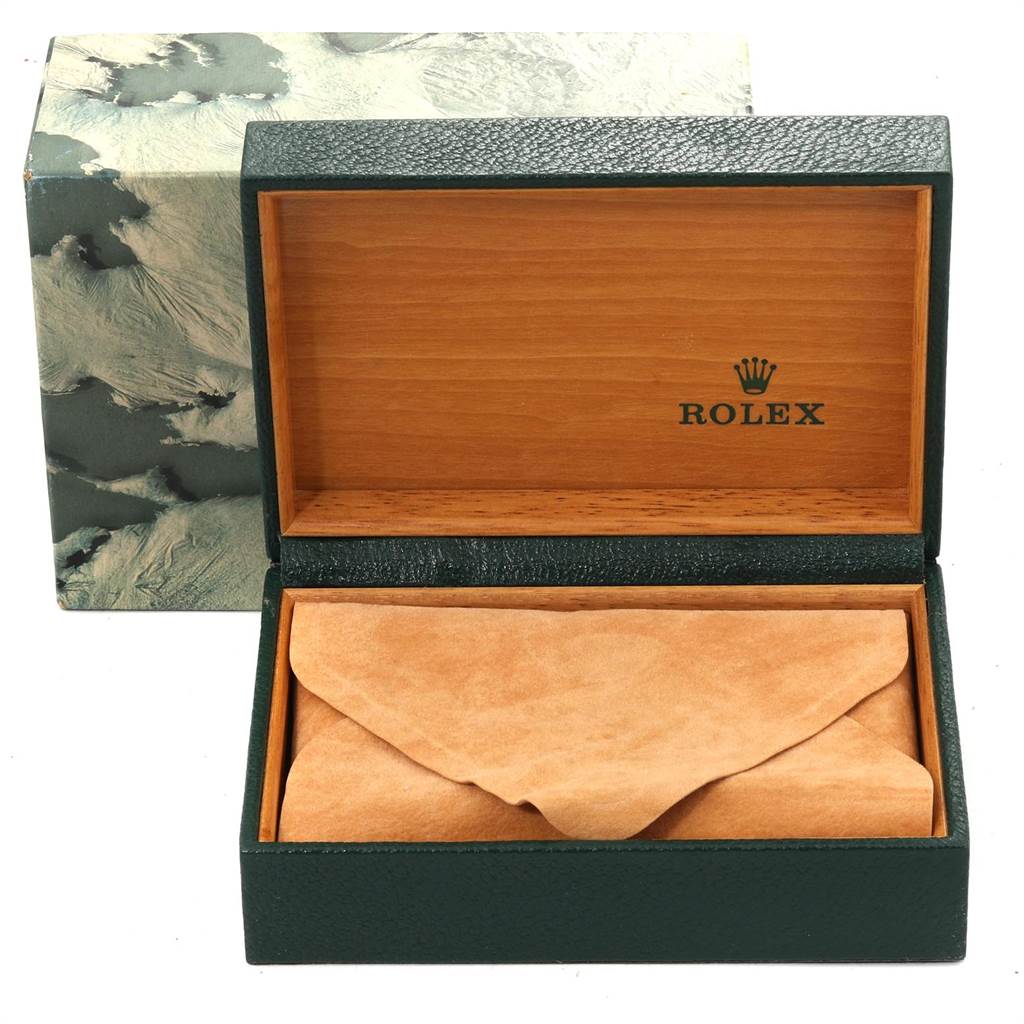 This image shows an opened Rolex watch box for the Vintage Collection model, revealing a wooden interior and a suede pouch.