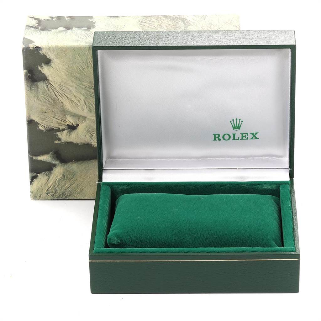 This image shows an open box for the Rolex Vintage Collection 16013 Men's Stainless Steel Champagne Dial 16013 Men's Stainless Steel Champagne Dial model watch, displaying its interior with a green cushion.
