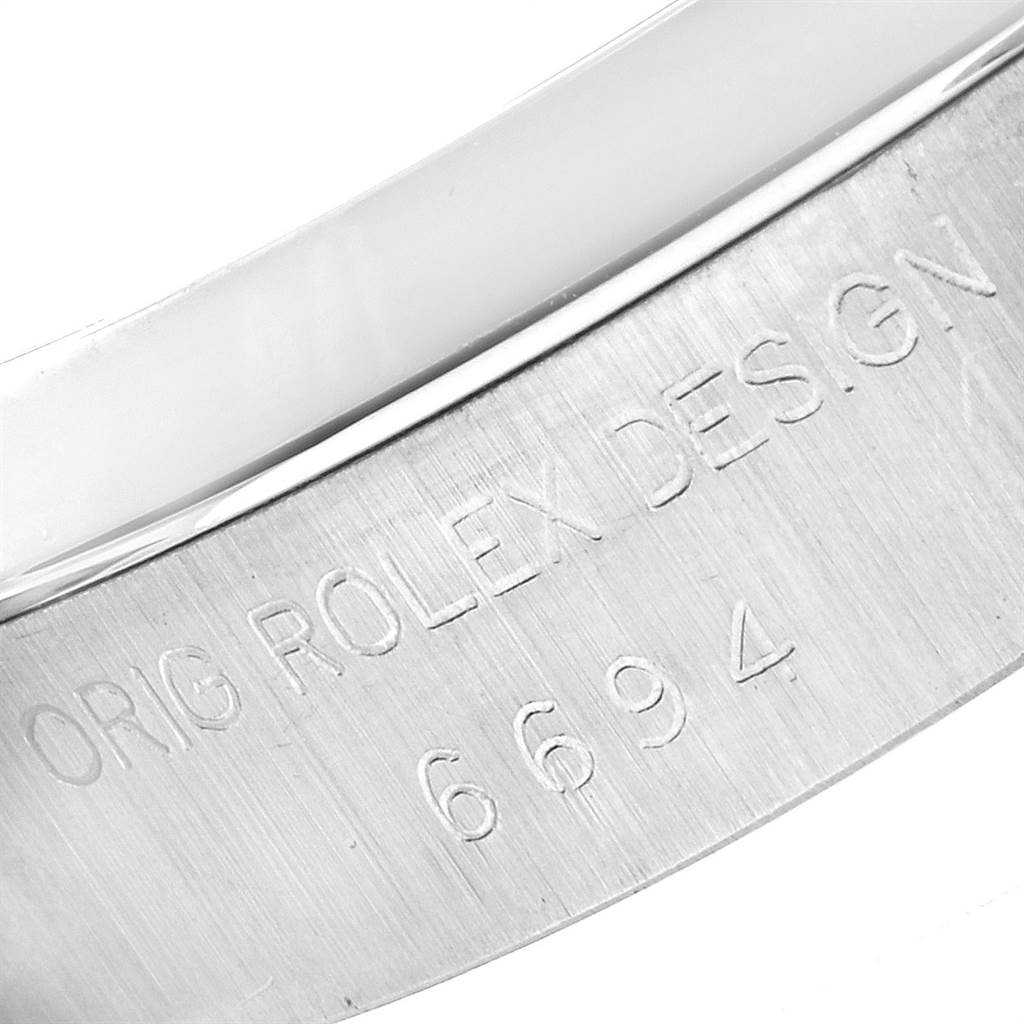 This image shows the detailed engraving on the metal surface of the Rolex Vintage Collection 6694 Men
s Stainless Steel Silver Dial 6694 Men
s Stainless Steel Silver Dial model with the design number 6694.