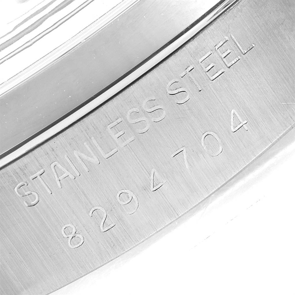 This image shows a close-up of the stainless steel casing and serial number of a Rolex Vintage Collection 6694 Men
s Stainless Steel Silver Dial 6694 Men
s Stainless Steel Silver Dial watch.