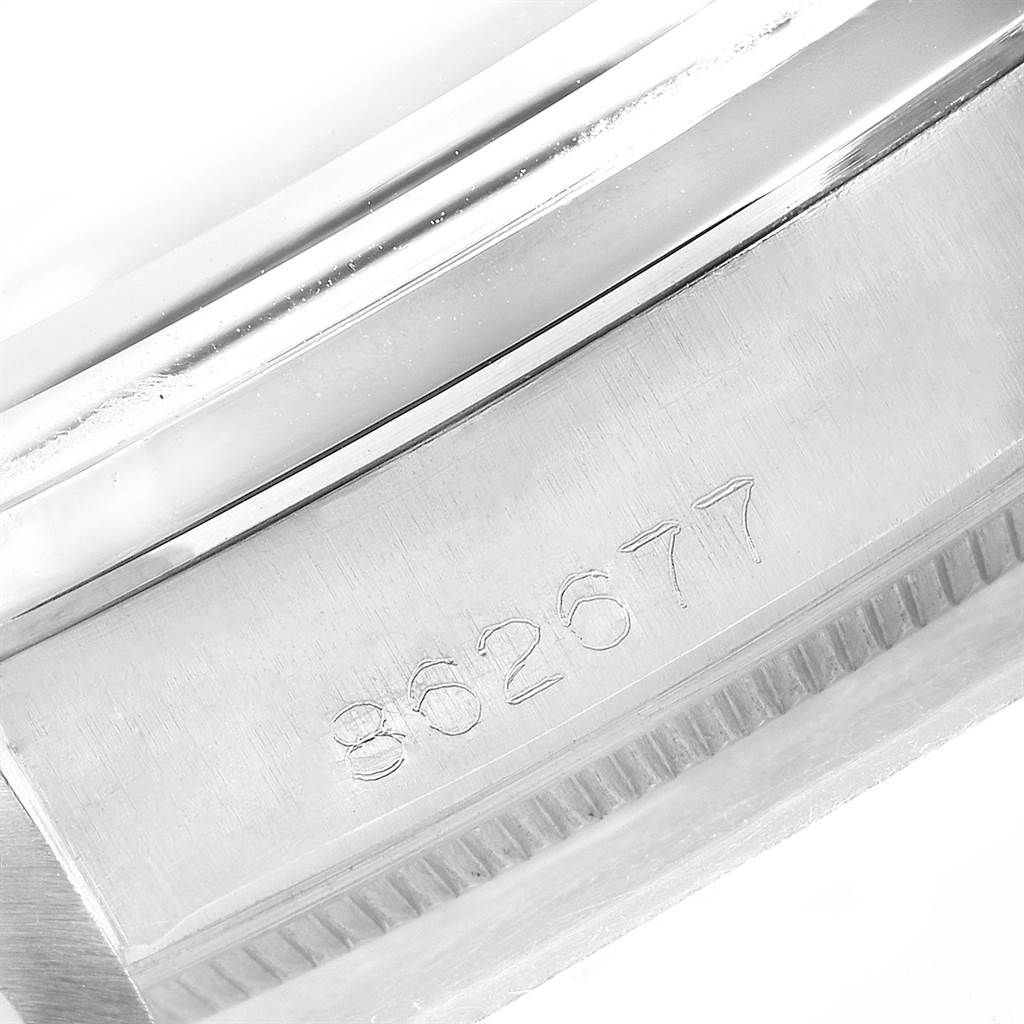 This close-up photo shows the serial number engraved on the case side of the Rolex Vintage Collection 1002 Men's Stainless Steel Silver Dial 1002 Men's Stainless Steel Silver Dial model.