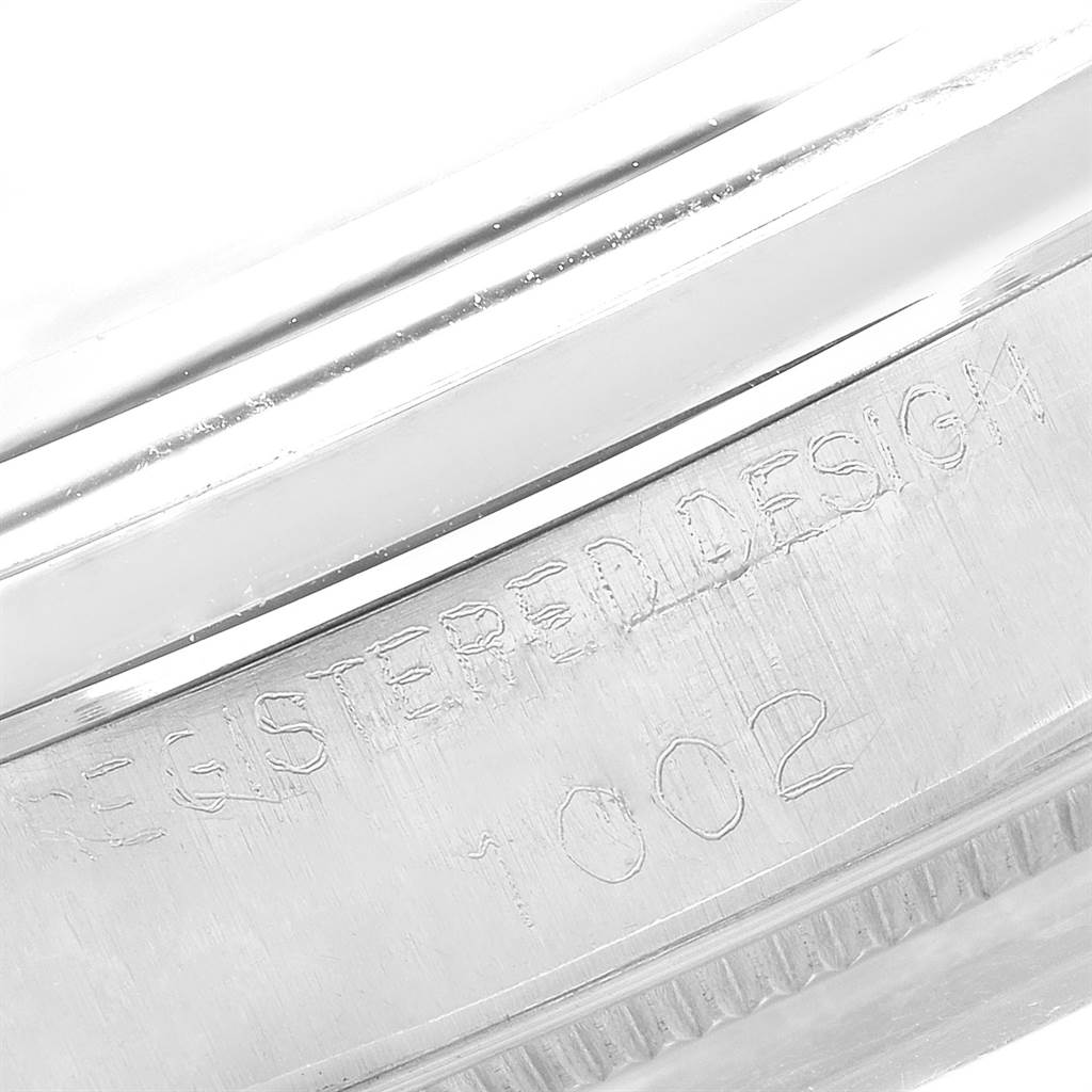 This close-up image shows the casing edge with engraved text of the Vintage Collection model by Rolex.