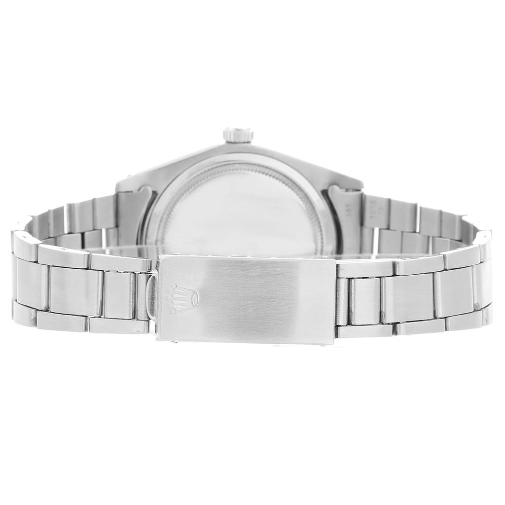 The image shows the back view of a Rolex Vintage Collection 6694 Men's Stainless Steel Black Dial 6694 Men's Stainless Steel Black Dial watch, focusing on its clasp and bracelet.