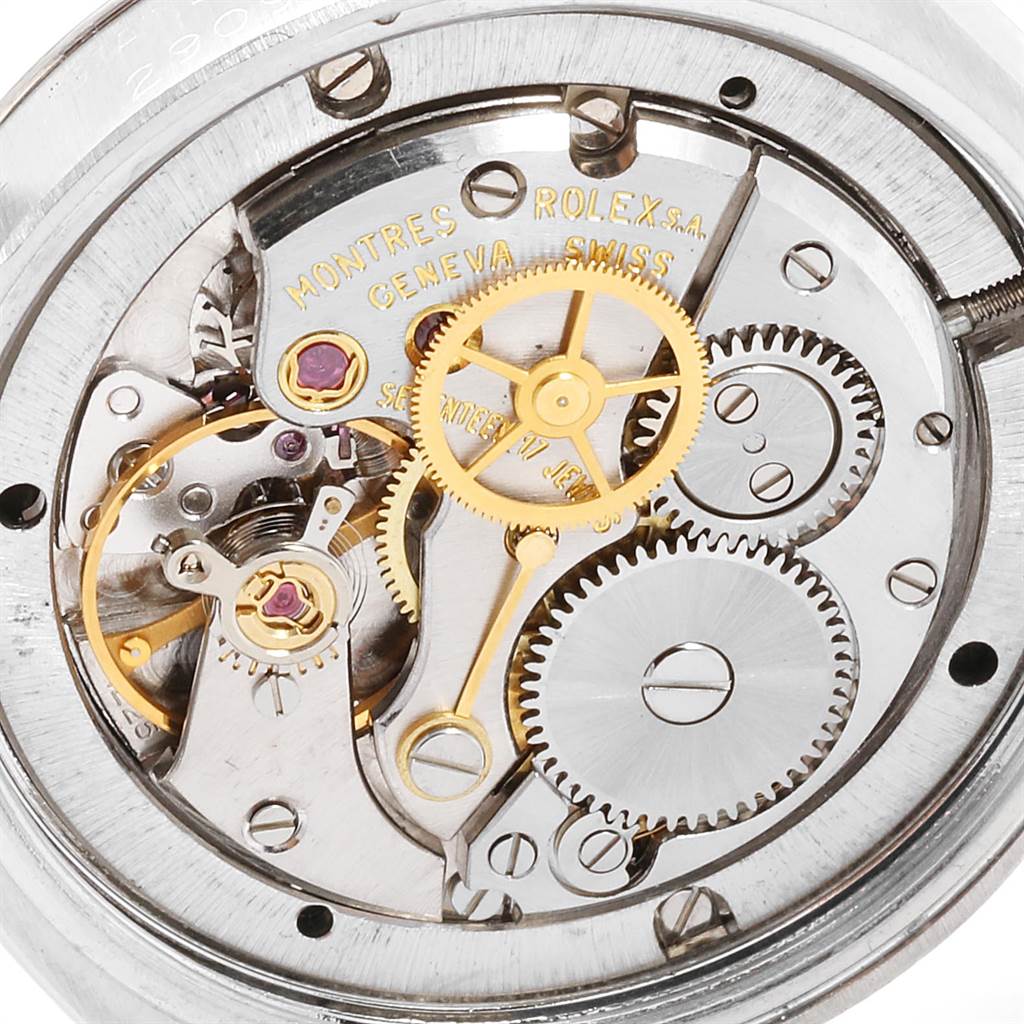 The image shows the inner mechanism of the Rolex Vintage Collection 6694 Men's Stainless Steel Black Dial 6694 Men's Stainless Steel Black Dial watch at an overhead angle, highlighting gears and inscriptions.