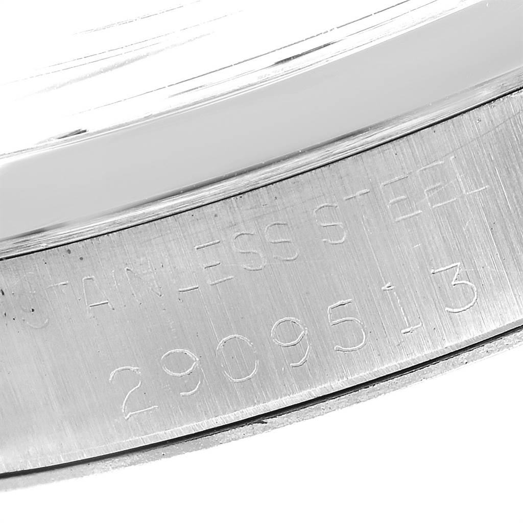 This image shows a close-up of the serial number and "stainless steel" engraving on a Rolex Vintage Collection 6694 Men's Stainless Steel Black Dial 6694 Men's Stainless Steel Black Dial watch.