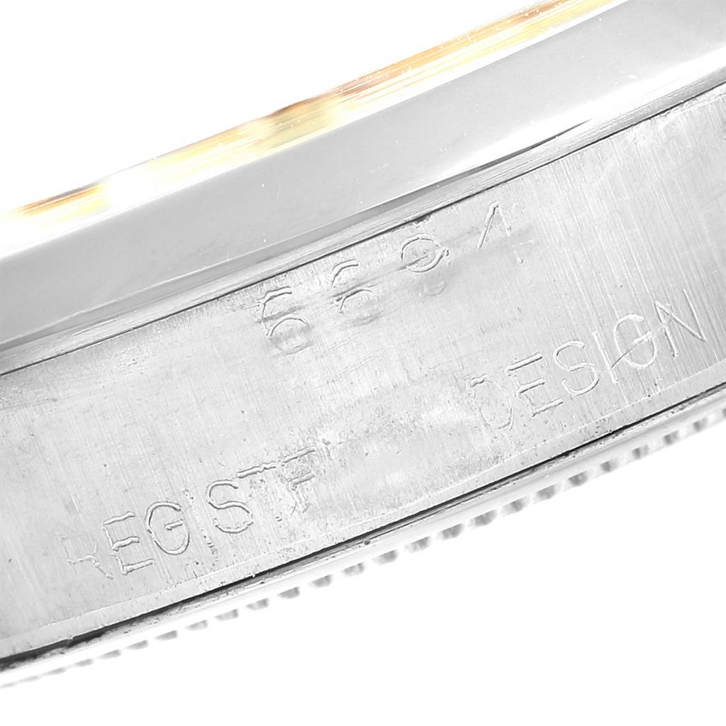 This image shows a close-up of the side engraving, including the serial number on a Rolex Vintage Collection 6694 Men's Stainless Steel Champagne Dial 6694 Men's Stainless Steel Champagne Dial watch.