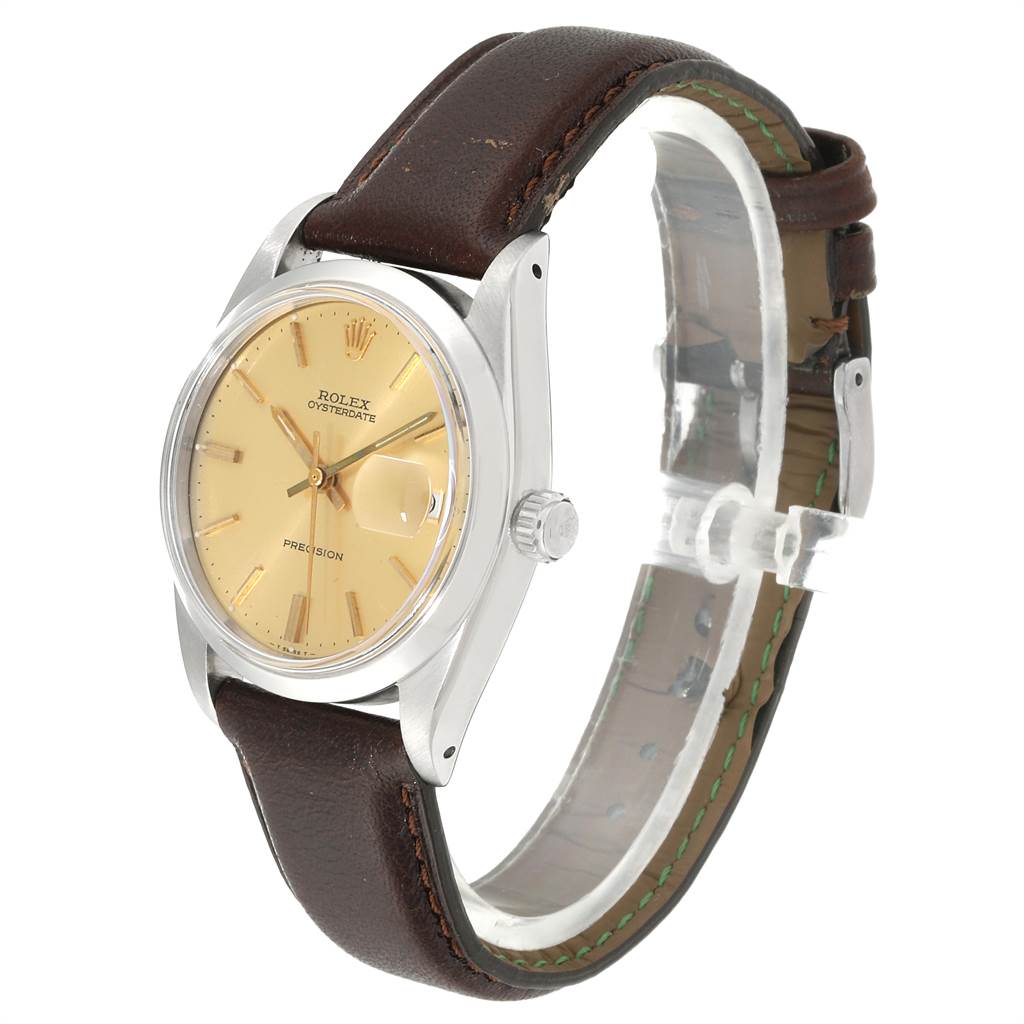 The Rolex Vintage Collection 6694 Men's Stainless Steel Champagne Dial 6694 Men's Stainless Steel Champagne Dial watch is shown at a three-quarter angle, displaying its face, bezel, crown, and leather strap.