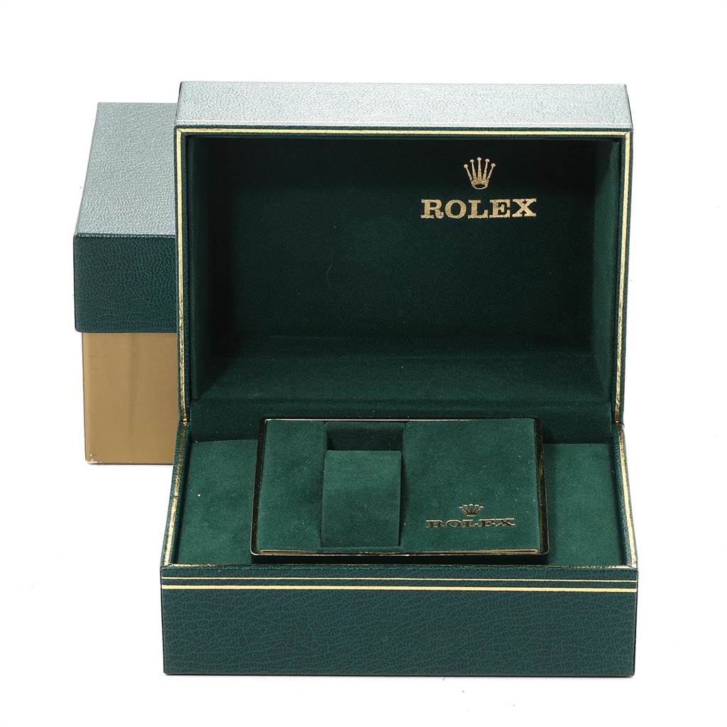 The image shows an open Rolex watch box from the Vintage Collection model, with a green interior and gold branding.