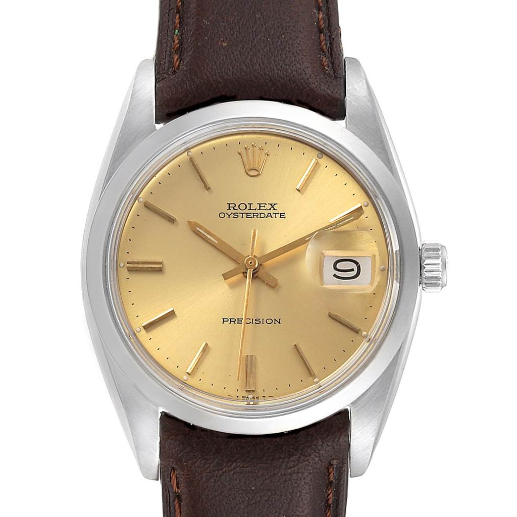 The image shows a Rolex Vintage Collection 6694 Men's Stainless Steel Champagne Dial 6694 Men's Stainless Steel Champagne Dial Oysterdate watch with a gold dial, brown leather strap, and a date magnifier at the 3 o'clock position.