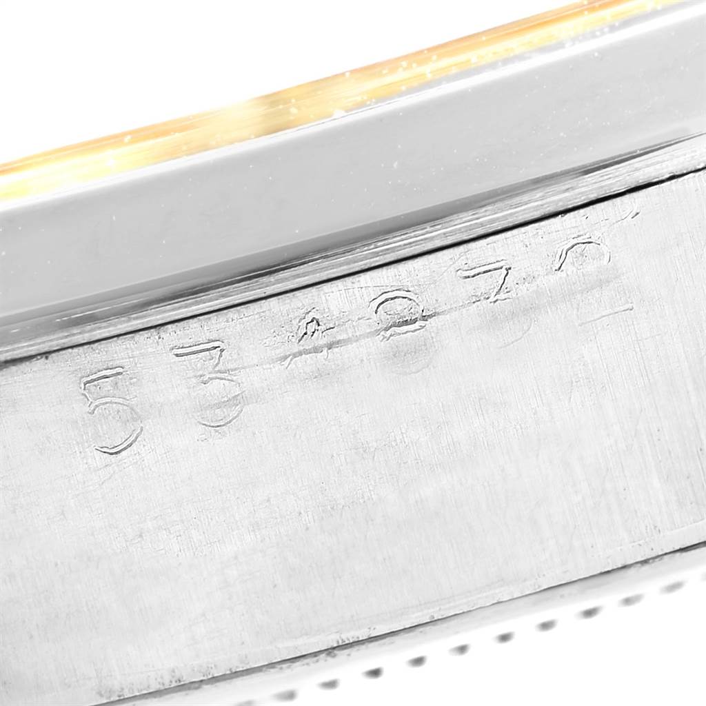 This image shows a close-up of the side of a Rolex Vintage Collection 6694 Men's Stainless Steel Champagne Dial 6694 Men's Stainless Steel Champagne Dial watch, revealing its serial number.