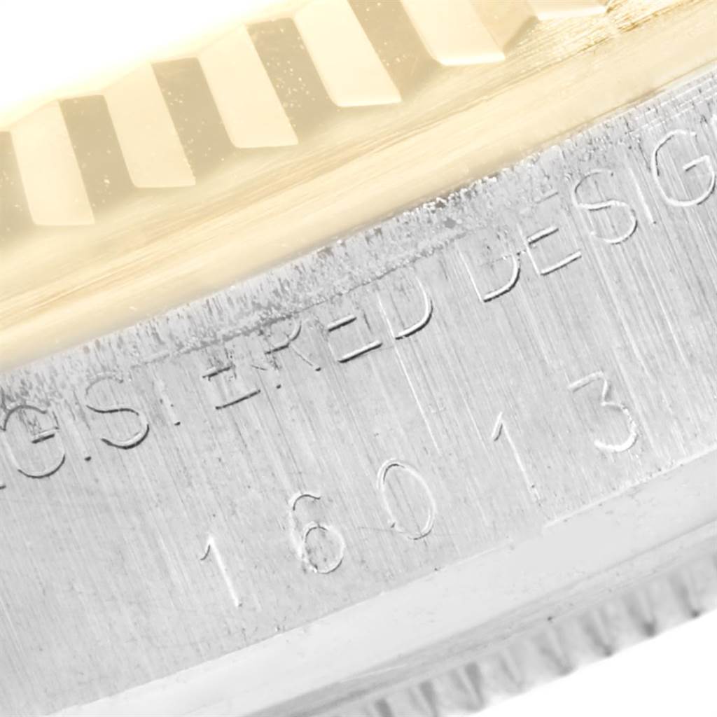 The close-up image shows the side of the bezel and part of the engraved case of the Rolex Vintage Collection 16013 Men's Stainless Steel Champagne Dial 16013 Men's Stainless Steel Champagne Dial model 16013.