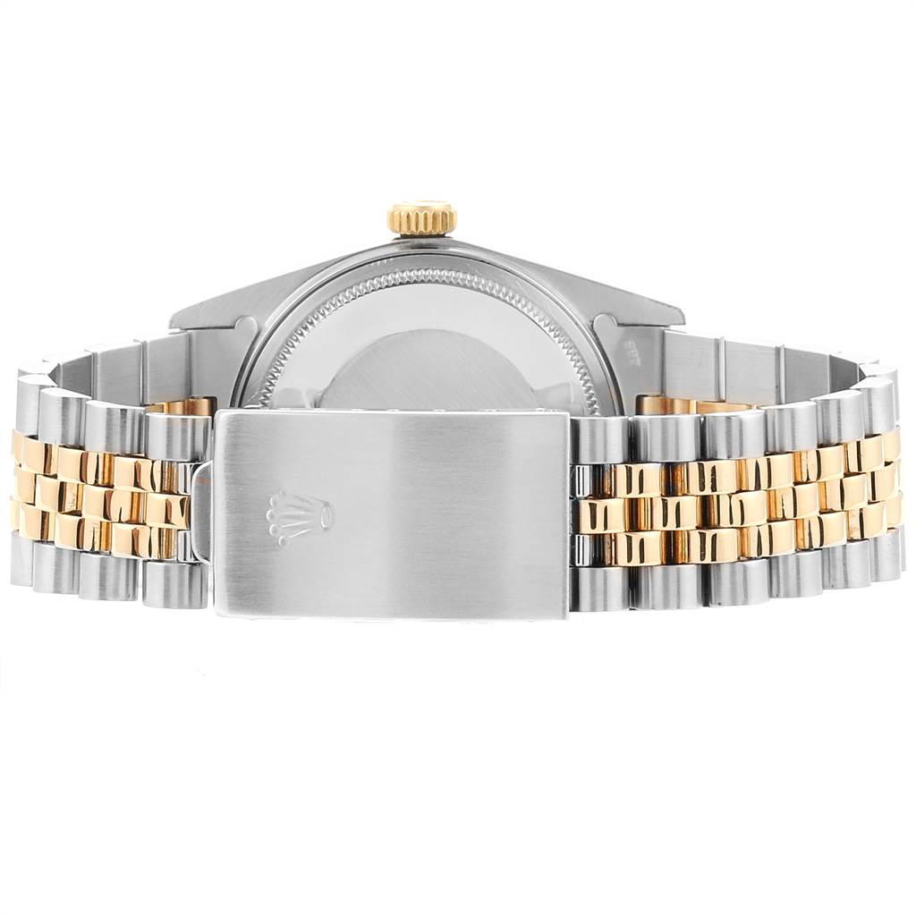 The image shows the back view of a Vintage Collection Rolex watch, highlighting the case and the two-tone bracelet with the clasp.