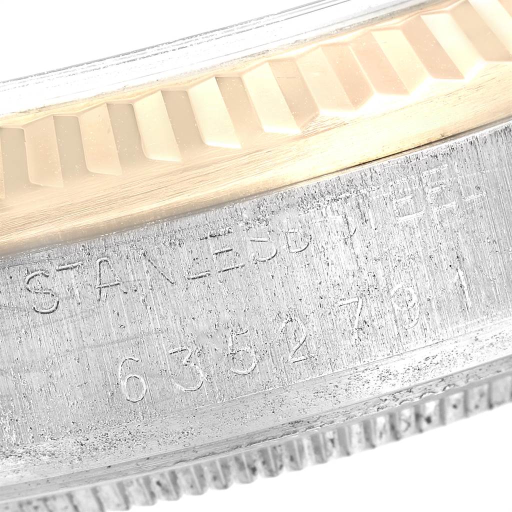 This close-up image shows the engraved stainless steel and part of the bezel of the Rolex Vintage Collection 16013 Men's Stainless Steel Champagne Dial 16013 Men's Stainless Steel Champagne Dial model.