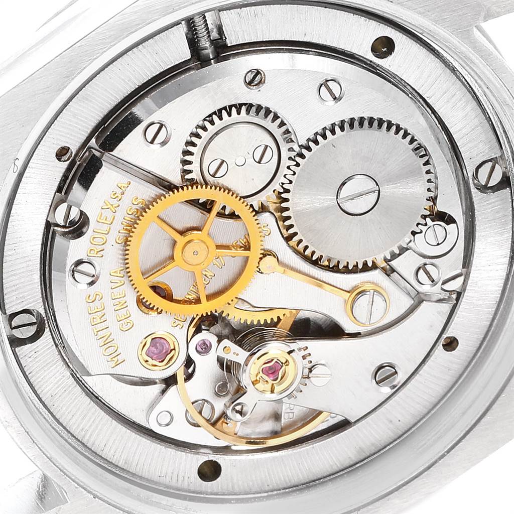 This image shows a detailed view of the intricate internal gears and components of a Rolex Vintage Collection 6694 Men's Stainless Steel Black Dial 6694 Men's Stainless Steel Black Dial watch.