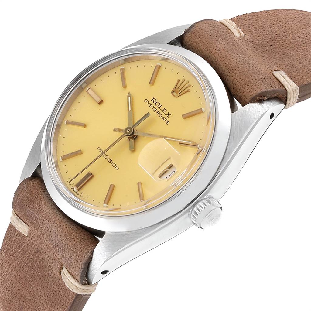 The image shows a Rolex Vintage Collection 6694 Men's Stainless Steel Champagne Dial 6694 Men's Stainless Steel Champagne Dial model watch from an angled side view, highlighting its face and partial leather strap.