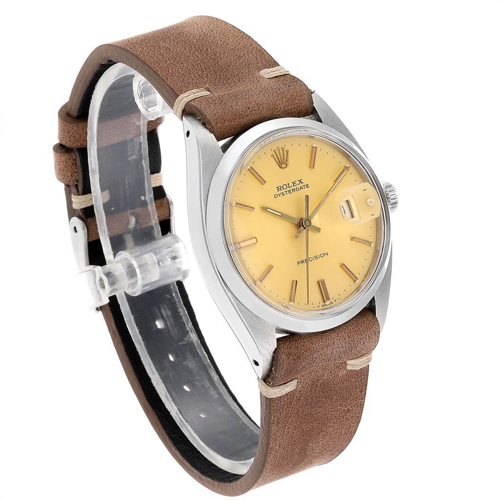 The Vintage Collection Rolex watch is shown at an oblique angle, showcasing its dial, case, crown, and brown leather strap.