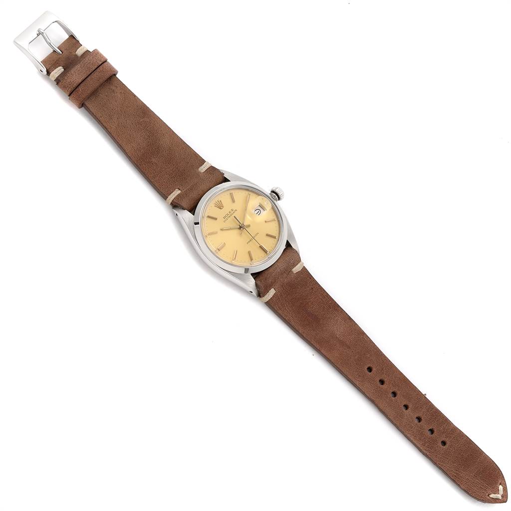 The image shows a Rolex Vintage Collection 6694 Men's Stainless Steel Champagne Dial 6694 Men's Stainless Steel Champagne Dial watch with a brown leather strap, angled flat with its face and strap fully visible.