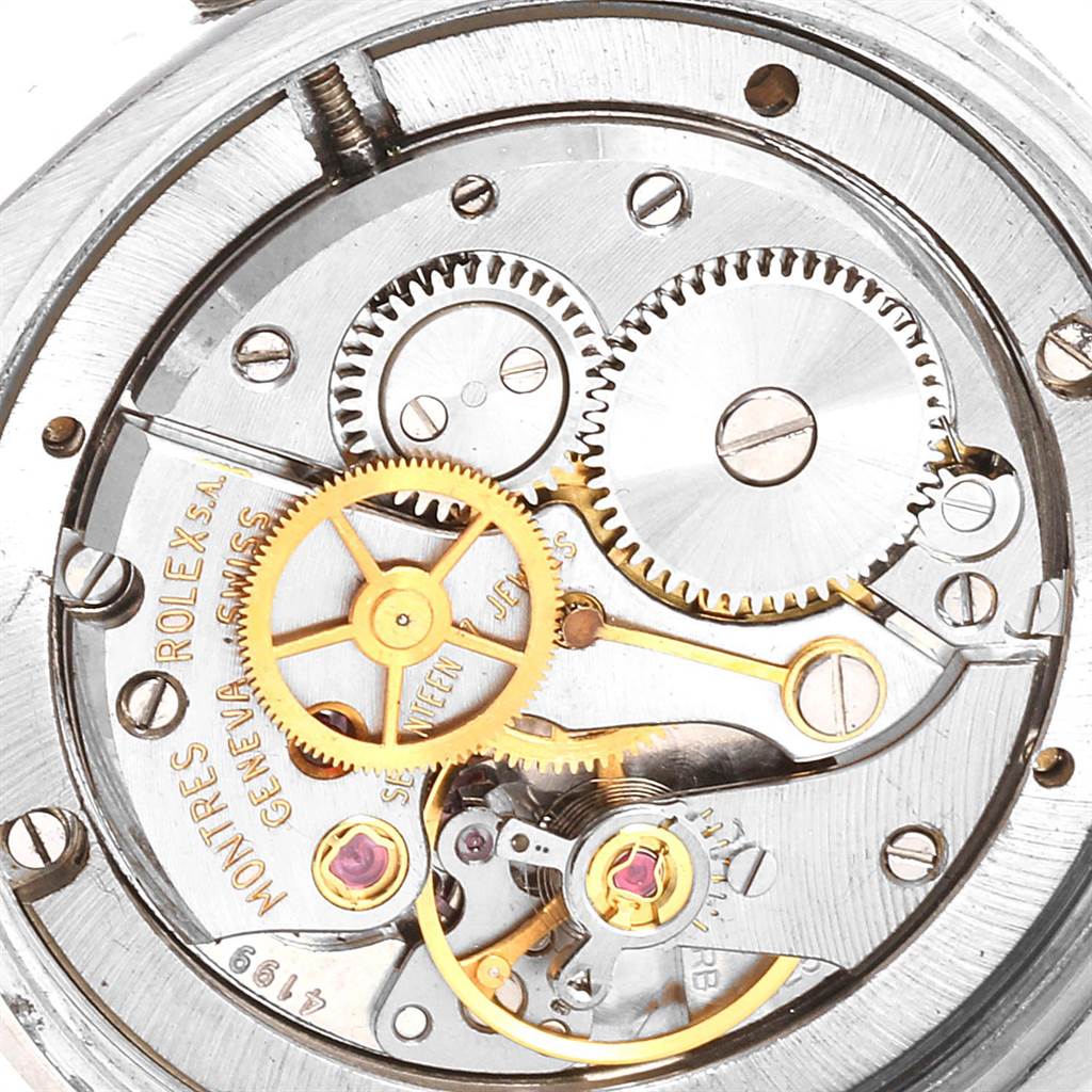 The image shows the inner mechanical movement parts of a Vintage Collection Rolex model from a top-down angle.