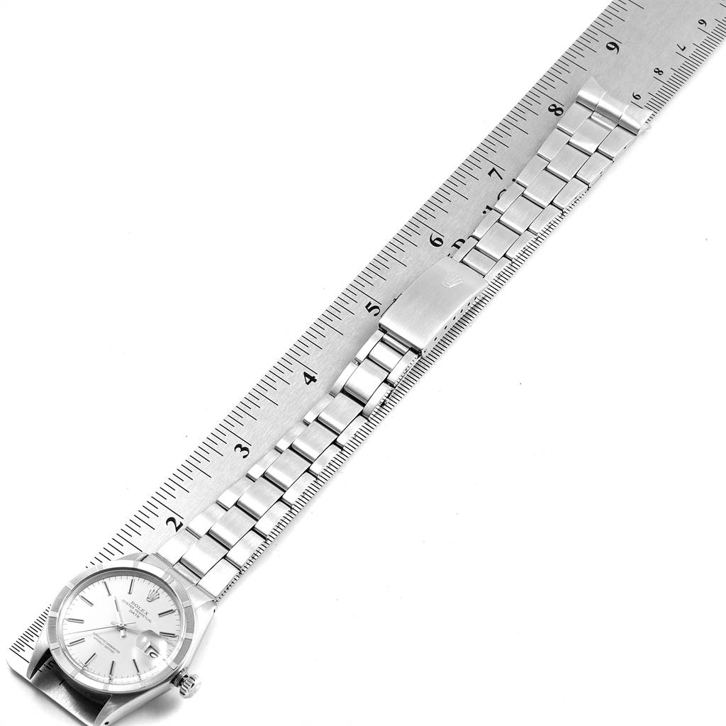 The image shows a Rolex Vintage Collection 1501 Men's Stainless Steel Silver Dial 1501 Men's Stainless Steel Silver Dial watch and bracelet placed adjacent to a ruler for measurement.