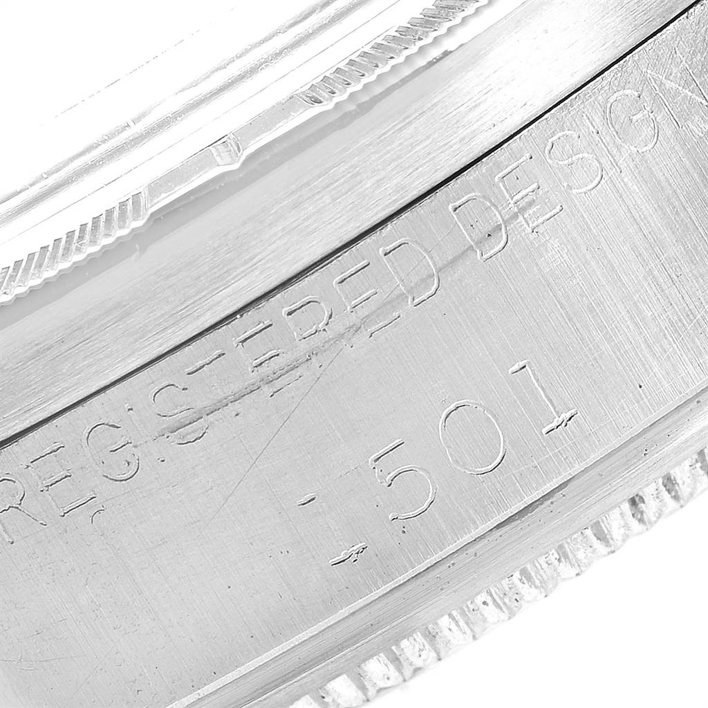 This image shows a close-up of the engraved serial number on the case side of a Rolex Vintage Collection 1501 Men's Stainless Steel Silver Dial 1501 Men's Stainless Steel Silver Dial watch.