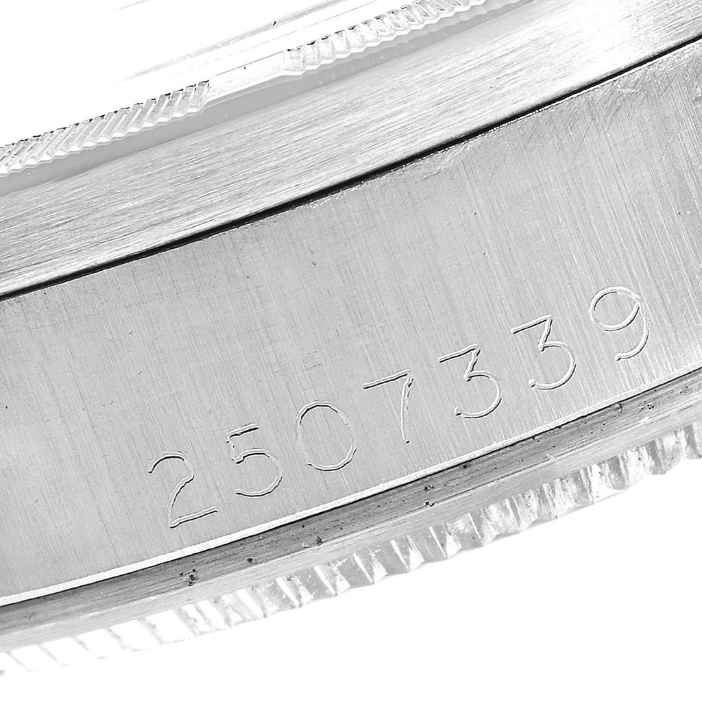 This image shows a close-up of the serial number engraved on the case of a Vintage Collection model by Rolex.