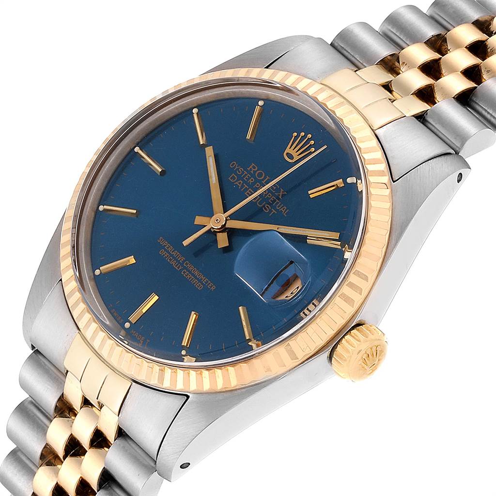 This image shows a Rolex Vintage Collection 16013 Men's Stainless Steel Blue Dial 16013 Men's Stainless Steel Blue Dial watch at a slight angle, highlighting the blue dial, gold fluted bezel, and part of the jubilee bracelet.