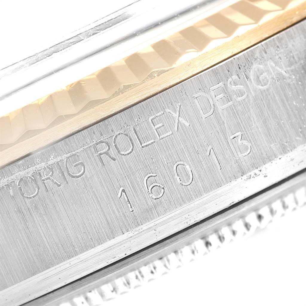 This close-up image shows the side engraving of the Rolex Vintage Collection 16013 Men's Stainless Steel Blue Dial 16013 Men's Stainless Steel Blue Dial model 16013.