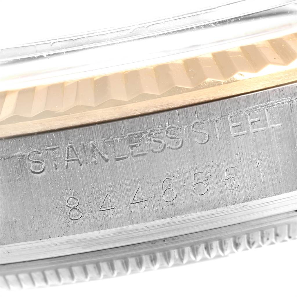 This image shows a close-up of the serial number and "Stainless Steel" engraving on the case of a Rolex Vintage Collection 16013 Men's Stainless Steel Blue Dial 16013 Men's Stainless Steel Blue Dial watch.