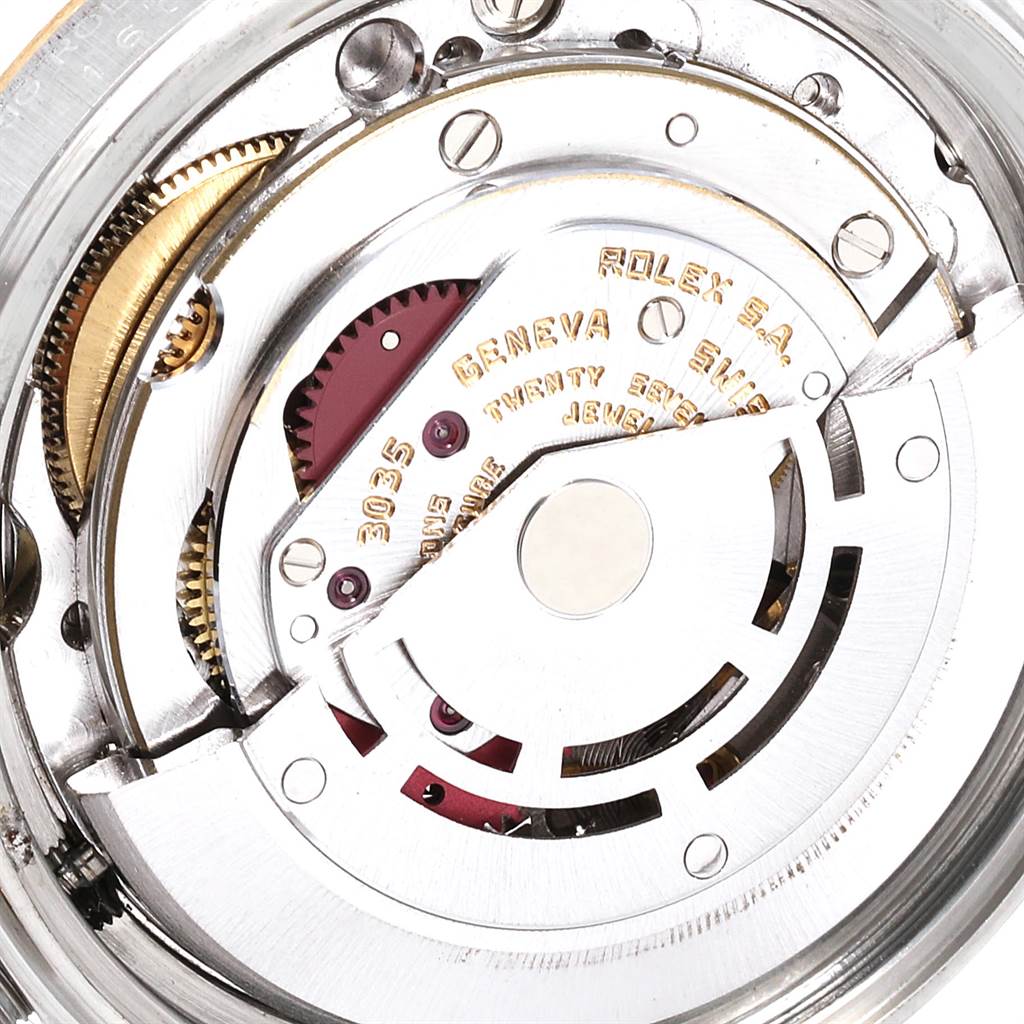 The image shows the intricate internal movement mechanism of a Vintage Collection Rolex watch.