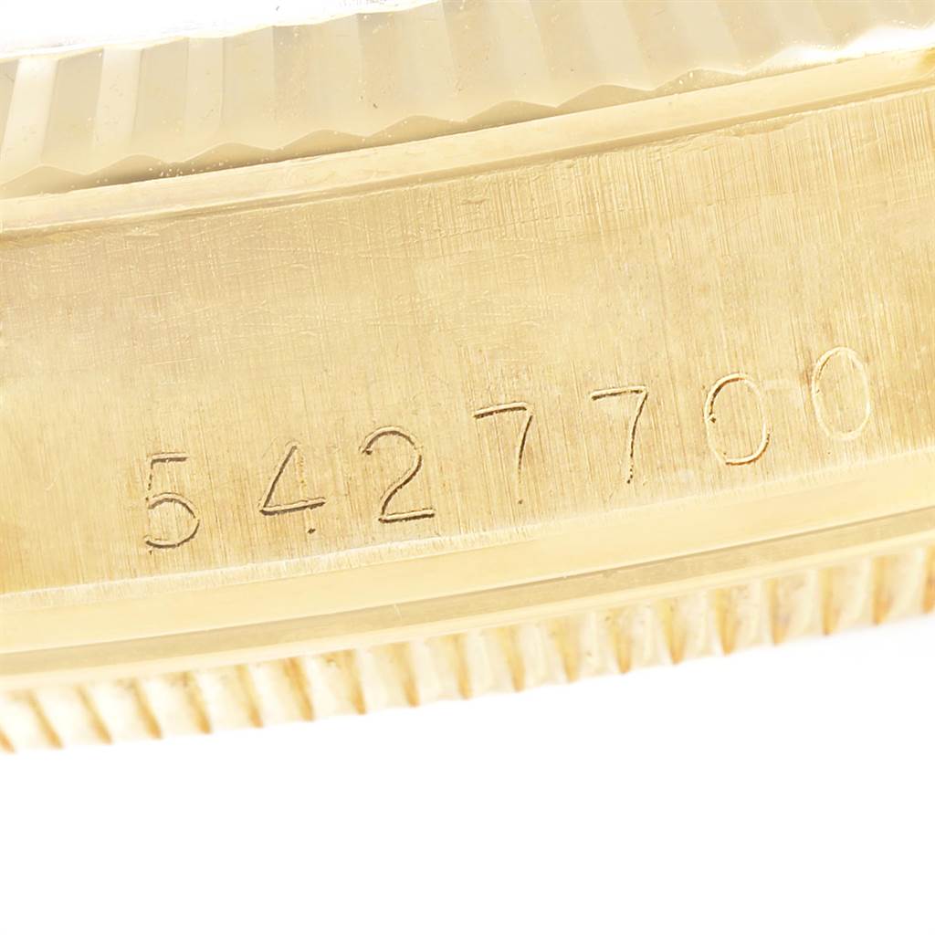 This close-up image shows the serial number engraving on the case side of the Rolex Vintage Collection 1503 Men's Yellow Gold Brown Dial 1503 Men's Yellow Gold Brown Dial model.