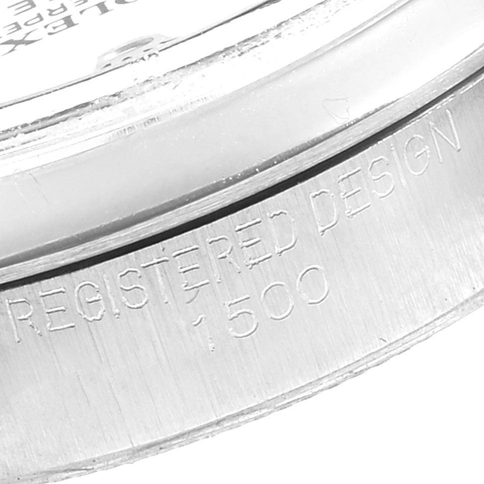 This image shows a close-up of the case and serial number engraving on the side of a Rolex Vintage Collection 1500 Men's Stainless Steel Silver Dial 1500 Men's Stainless Steel Silver Dial watch.