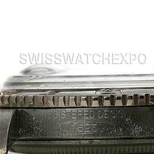 This is a close-up side view of a Vintage Collection Rolex watch, showing the bezel, crystal, and part of the case with engravings.